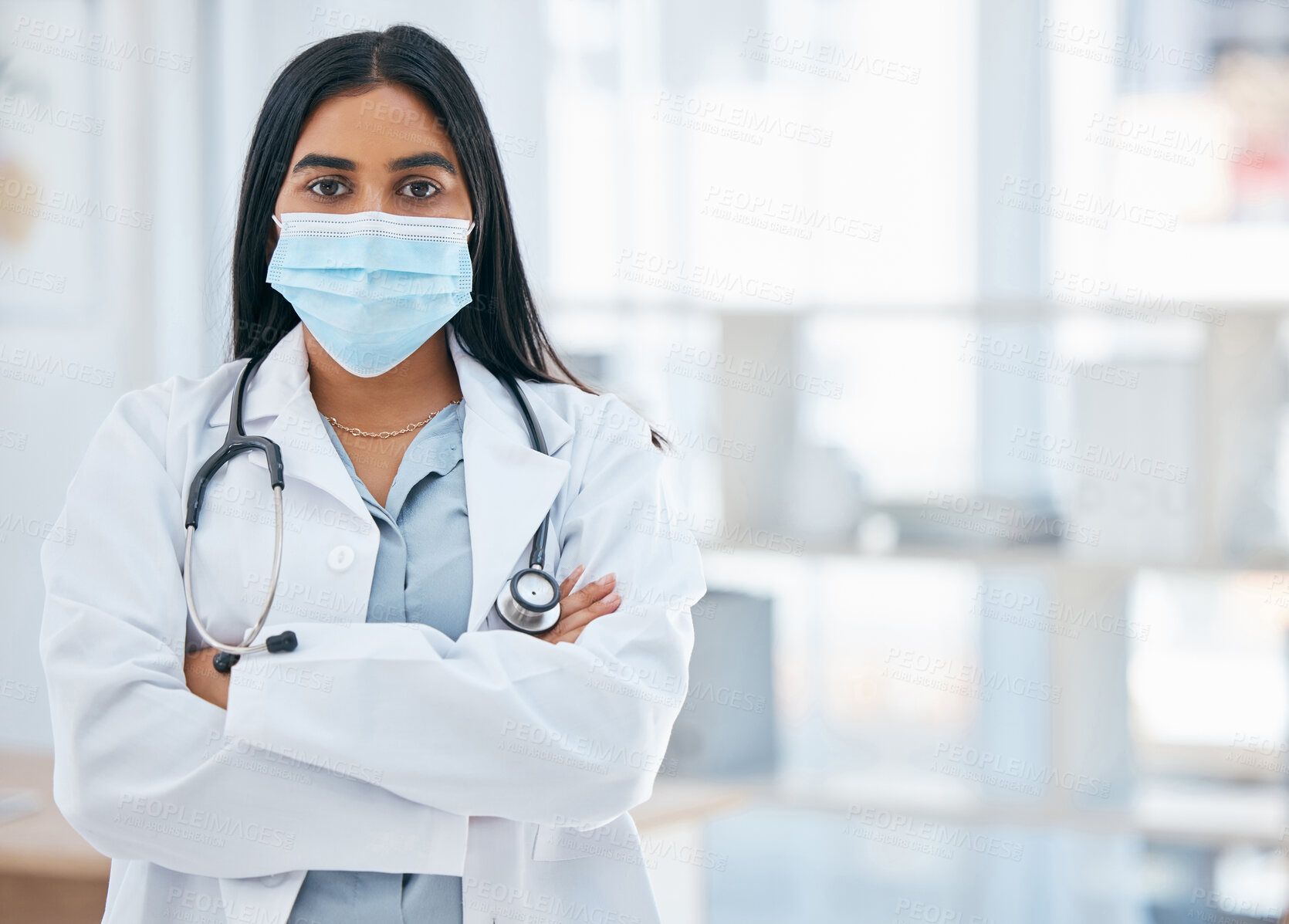 Buy stock photo Woman doctor, covid hospital and portrait of young, professional or medical cardiology expert staff working in clinic. Corona virus, female healthcare worker or face mask safety in surgery consulting