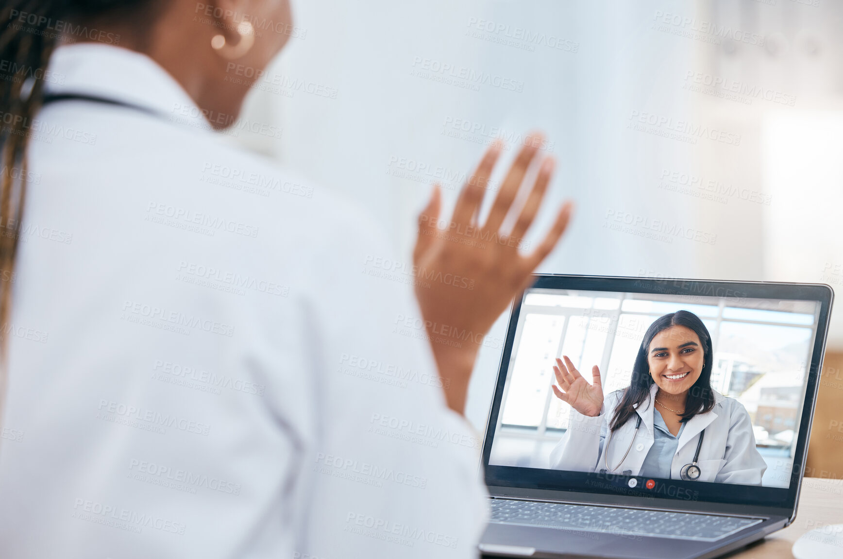 Buy stock photo Online meeting, video call and doctors talking on a laptop in office in a hospital with technology. Wave, healthcare and medical professionals discussing medicine, treatment or surgery on a computer.