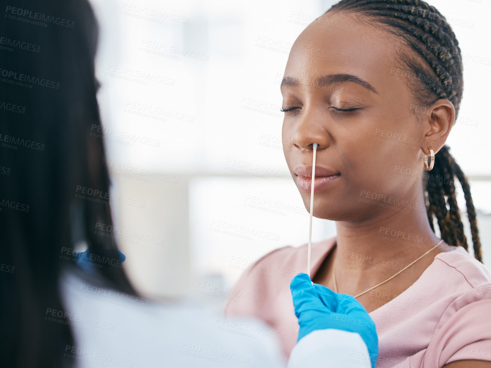 Buy stock photo Woman, doctor and covid test in a hospital for healthcare, research and innovation. Black woman, nose and corona swab with nurse in consultation room for compliance, results and health checkup