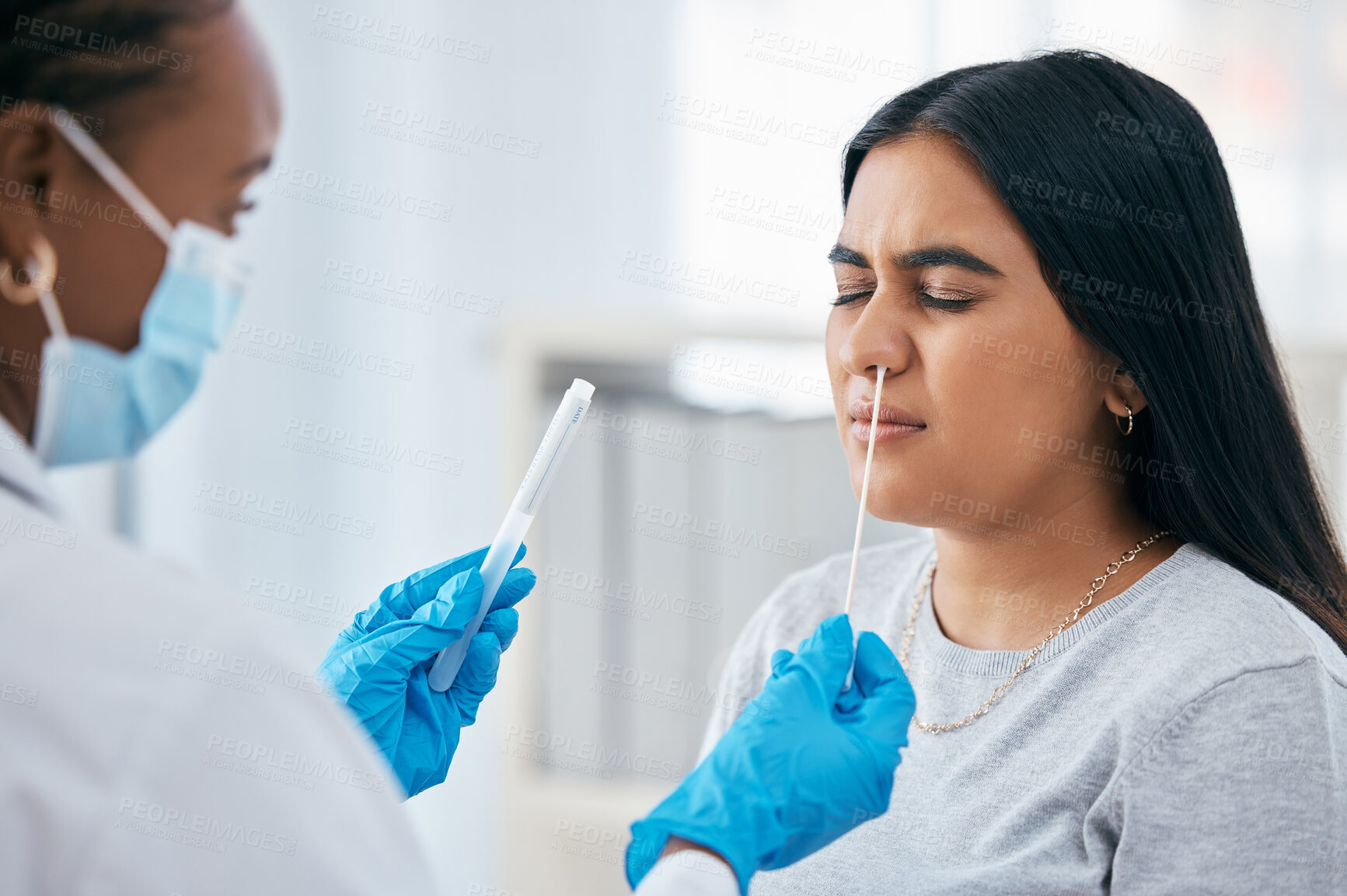 Buy stock photo Healthcare, covid, and test with doctor and patient in consultation room in hospital, science and research. Medical, woman and corona test with nose swab for sample, innovation laboratory analysis