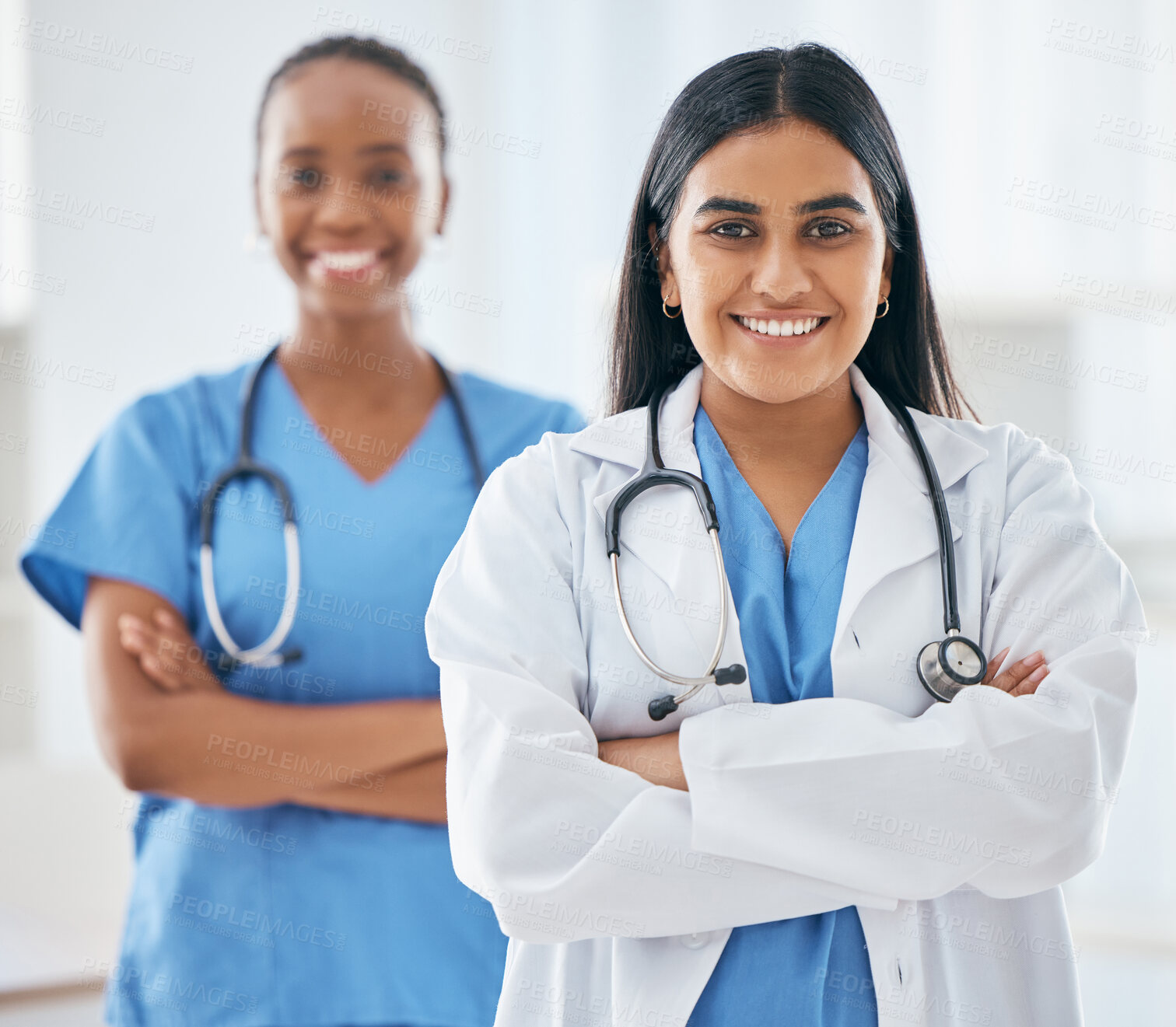 Buy stock photo Happy, portrait and women doctors in collaboration standing with crossed arms in hospital, Happiness, teamwork and leadership of healthcare workers with a smile after success consultation or surgery.