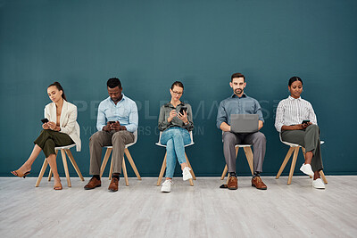 Buy stock photo Recruitment, phone and laptop chair row of people at workspace corridor waiting with mockup. Company interview queue process with online connection for application, notes or social media.


