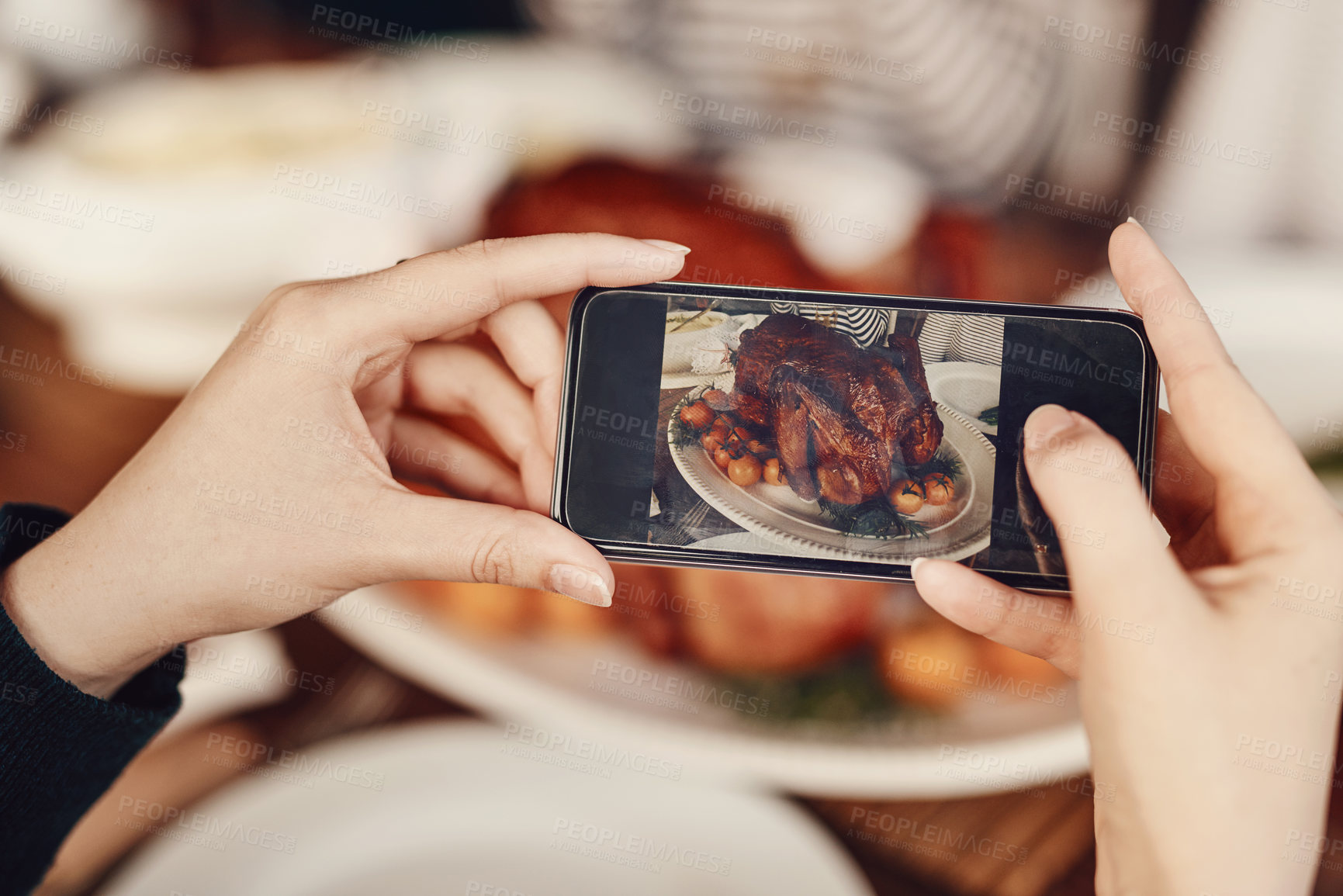 Buy stock photo Phone, photograph and thanksgiving with the hands of a woman taking a picture of food on a dinner table. Mobile, social media and Christmas with a female using her smartphone to photo a roast meal