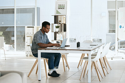 Buy stock photo Creative, designer and laptop in web design or online marketing, advertising or development at the office. Black man employee working on computer in design for corporate company at the workplace