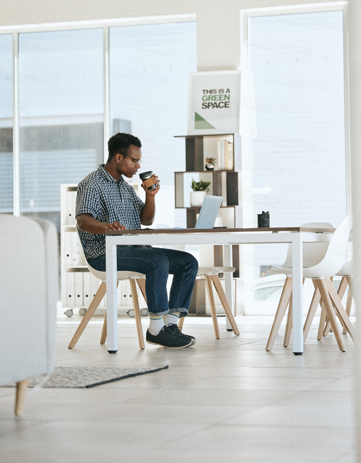Buy stock photo Black man, coffee drinking and office with laptop, table and thinking in marketing startup business. Man, drink espresso or tea at desk with computer, reading and planning for digital marketing job