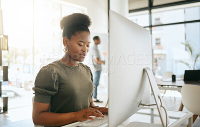 Buy stock photo Business, black woman and typing on computer, internet research and email, web design and marketing analytics at office desk in startup. Young african female employee working on desktop pc technology