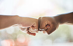 Fist bump, race solidarity and hands of team together for team building support, diversity and partnership collaboration. Bokeh background, racism and friendship goal welcome greeting collaboration 
