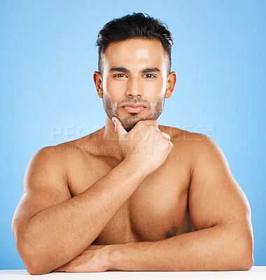 Buy stock photo Portrait, muscular man and health for wellness, skincare and hygiene with blue studio background. Athlete male, bodybuilder and happy for body care, workout and content with motivation and fitness.