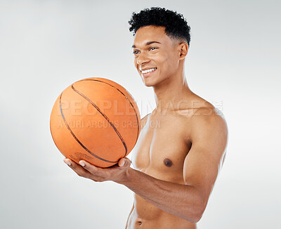 Buy stock photo Basketball, fitness and black man in studio training, exercise and wellness with smile for sports competition. Power, muscle and happy athlete, basketball player or model with a ball for game workout