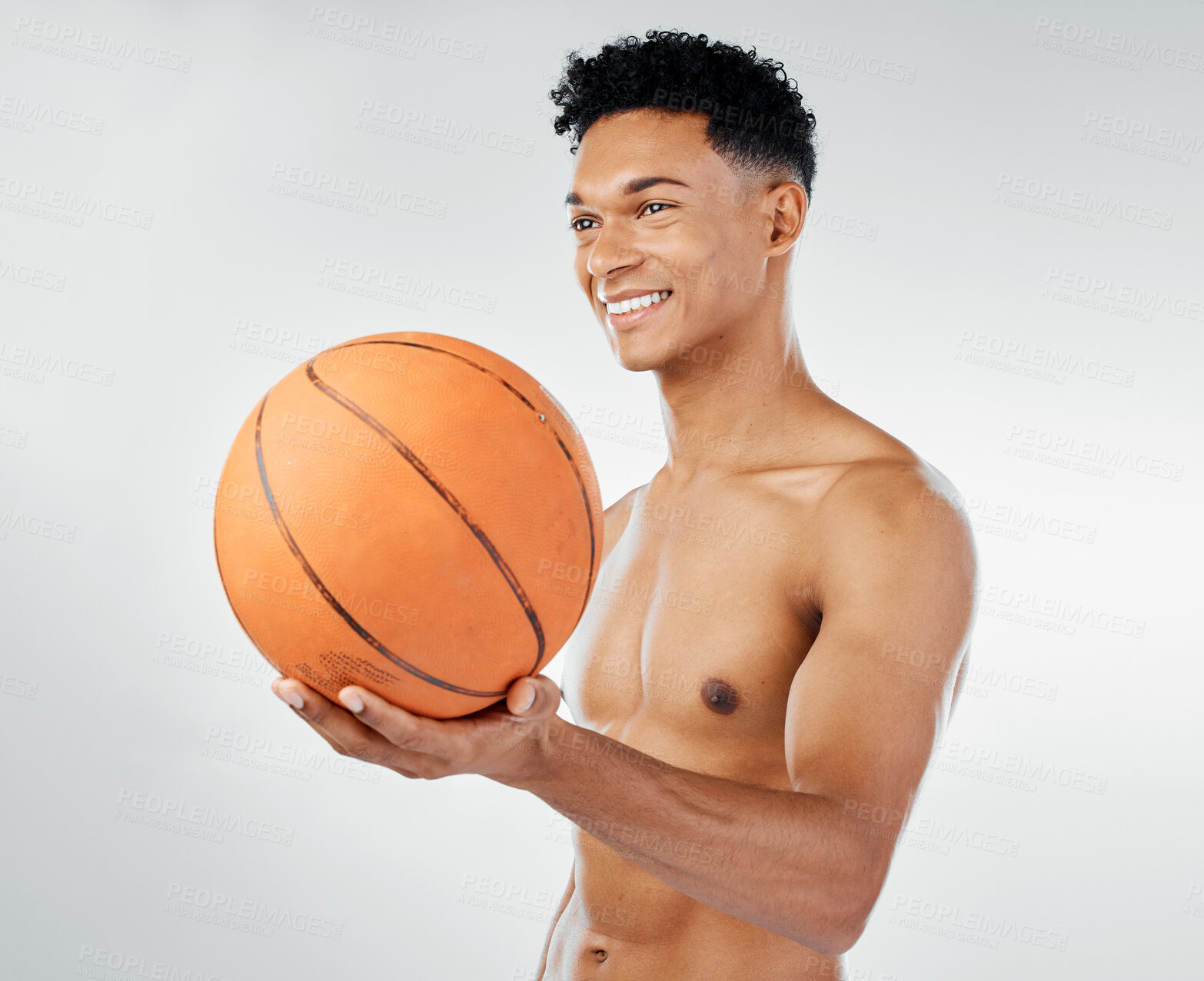 Buy stock photo Basketball, fitness and black man in studio training, exercise and wellness with smile for sports competition. Power, muscle and happy athlete, basketball player or model with a ball for game workout