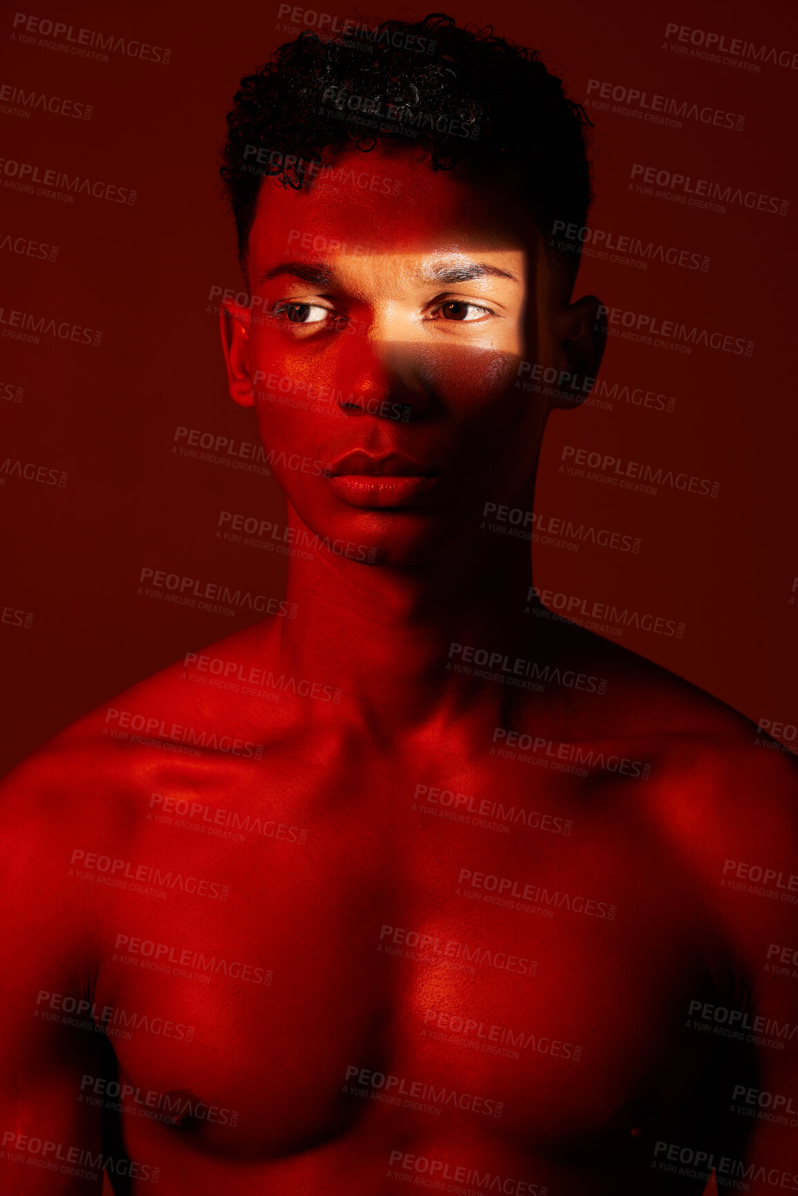 Buy stock photo Neon red, dark light and black man with artistic lighting design, beauty and creative facial shadow. Luxury skincare glow, aesthetic creativity and health wellness model isolated on studio background