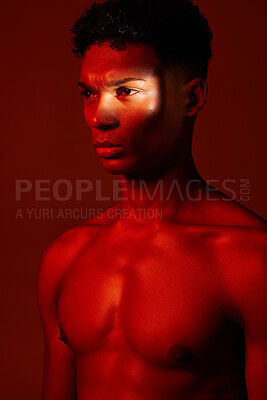 Buy stock photo Red, light and body, beauty and man isolated on studio background. Neon light, serious facial expression and male model from Brazil thinking, lost in thought or focus on fitness, health and wellness.