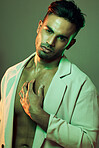 Beauty, green lights and portrait of sexy man from India touching bare chest in creative studio shoot. Fashion, neon light and professional male model, single Indian man online dating profile picture