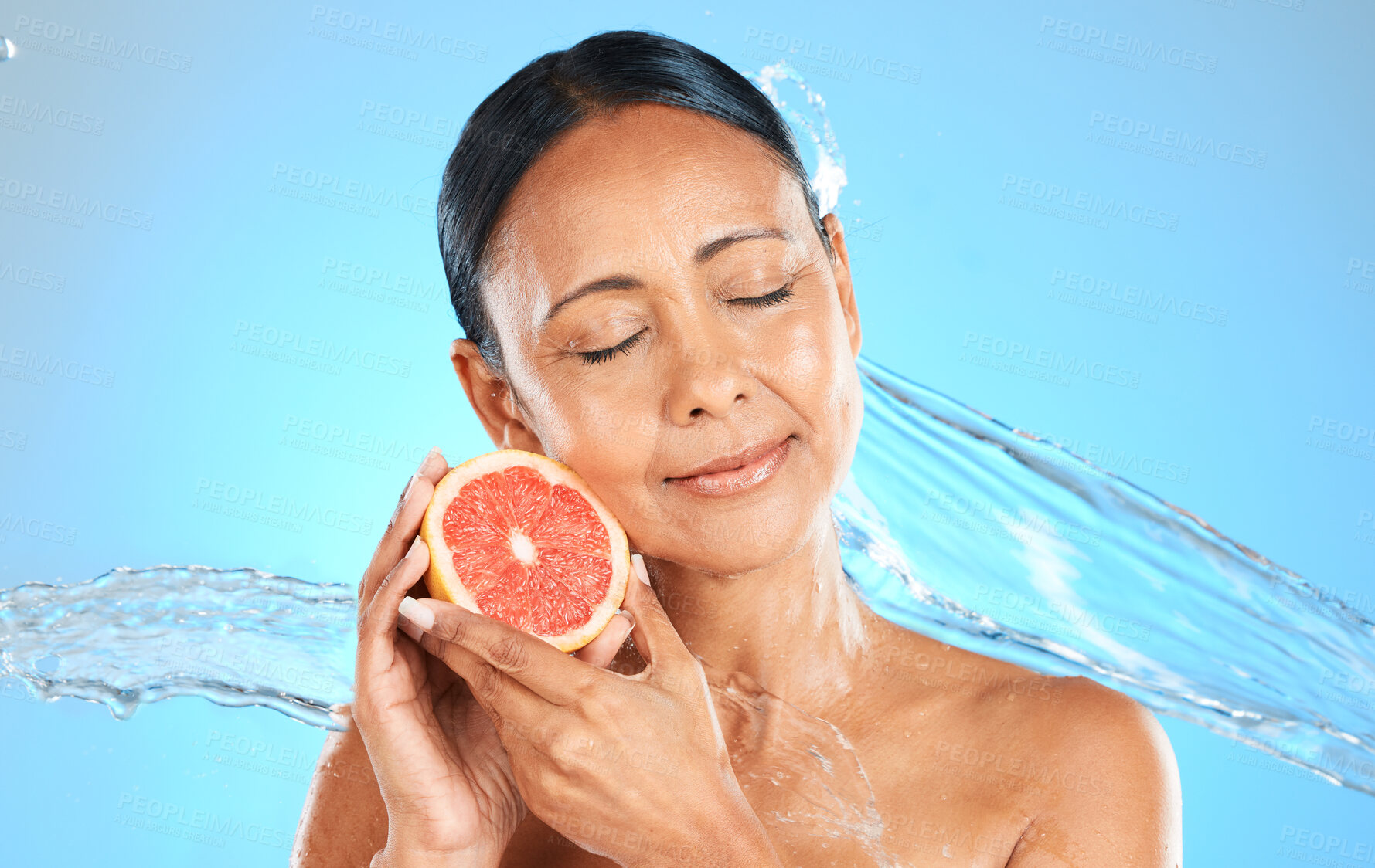 Buy stock photo Water splash, fruit and skincare wellness of a woman with a grapefruit feeling health and beauty. Diet, nutrition and healthy skin of a model with natural organic produce feeling calm and peace