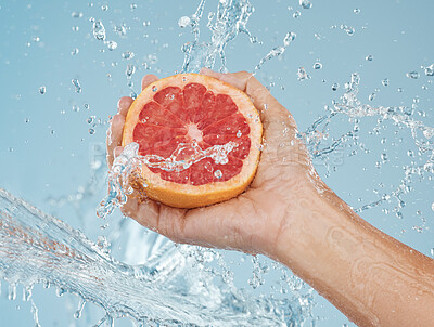 Buy stock photo Grapefruit, fruit and water for health of body and skin with natural diet to lose weight or skincare with dermatology food. Hand holding vitamin c snack for a healthy lifestyle or female orgasm