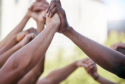 Buy stock photo Diversity, holding hands and support with solidarity and prayer circle outdoor together. Group hands in air, motivation and team building for collaboration help, trust and friends hope for community.