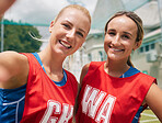 Selfie, sports and women team smile after a competition or game on netball court, field or outdoor park in Australia with cellphone for social media. Happy netball people or friends in phone portrait