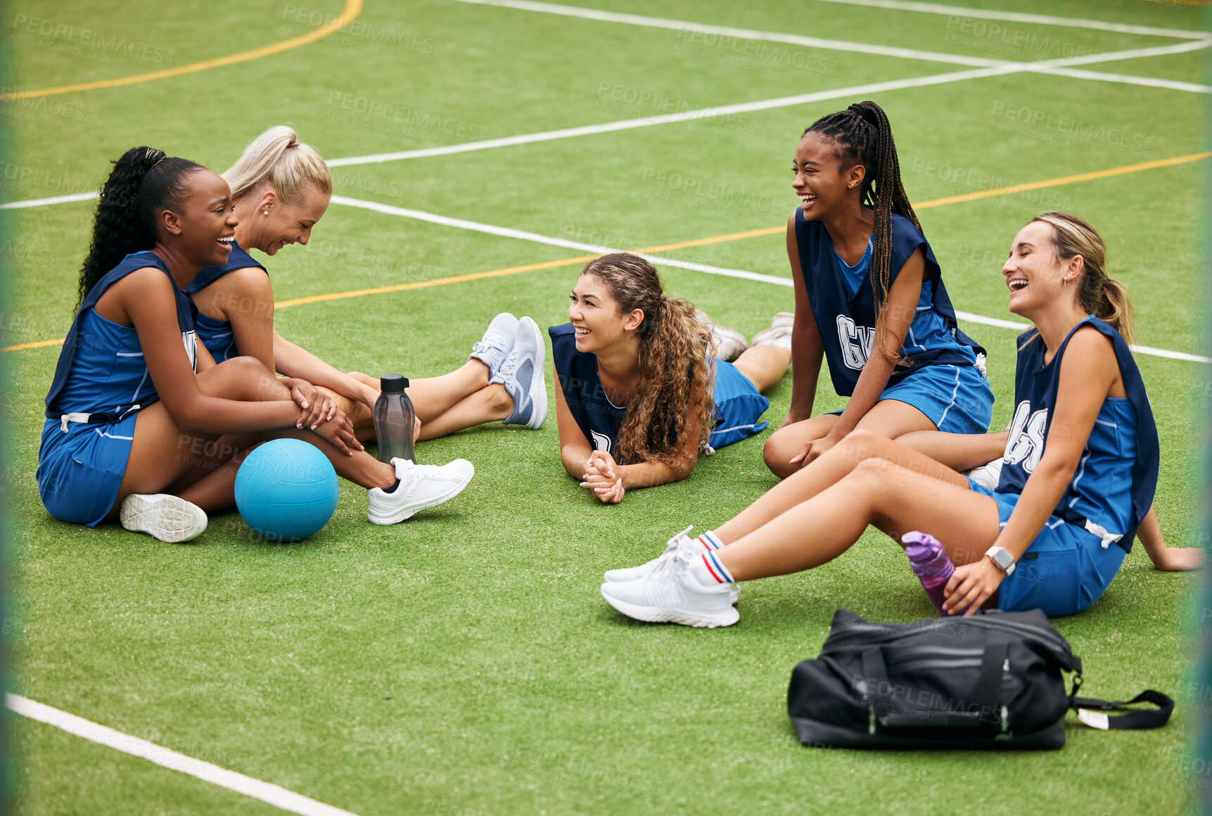 Buy stock photo Sports, field and women team relax on grass with fitness gear talking about game, goal strategy and being social together. Happy, diversity and young girl netball group or people rest on sport pitch