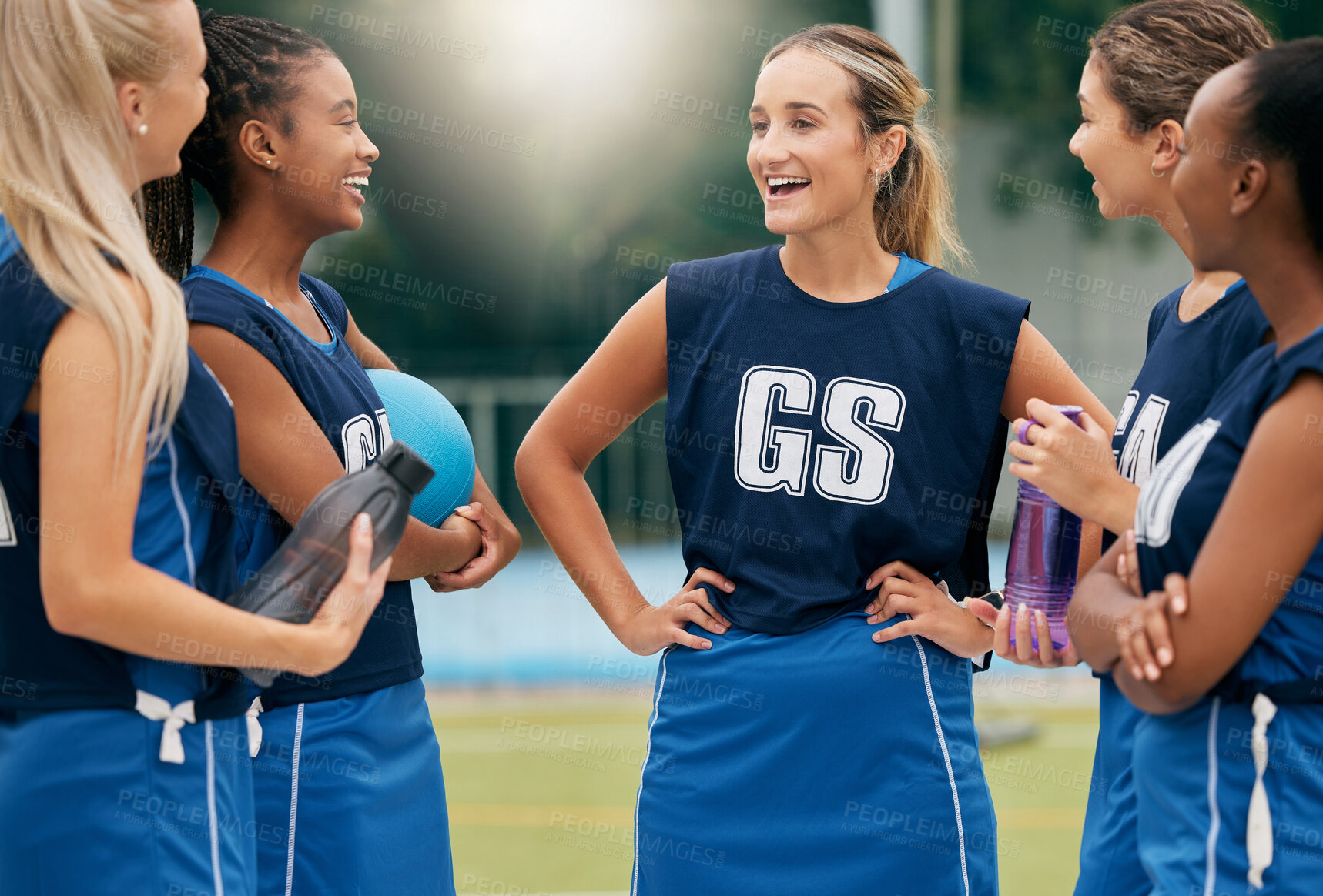 Buy stock photo Women, netball and team talking, happy and smile after training, game or match on a court outdoor. Team, collaboration or support with sports group smiling, fitness or positive mindset after practice