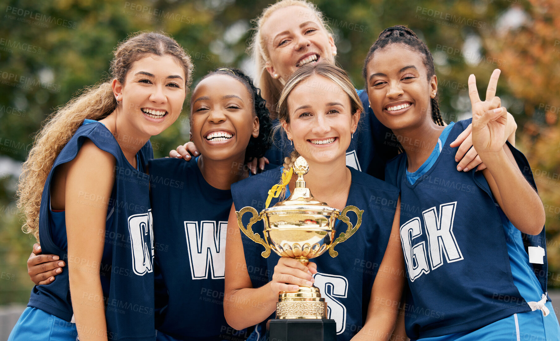 Buy stock photo Trophy, sports and winner women team celebration portrait for international netball competition or game event with support, teamwork and achievement. Excited athlete girl group winning a prize goal
