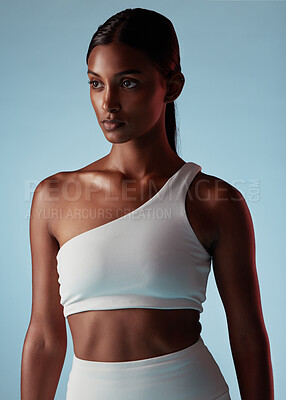 Buy stock photo Fitness, health and sports black woman on studio blue mock up for fashion advertising or marketing. Mission, goal and focus athlete with skin health, glow and exercise wellness lifestyle with mockup