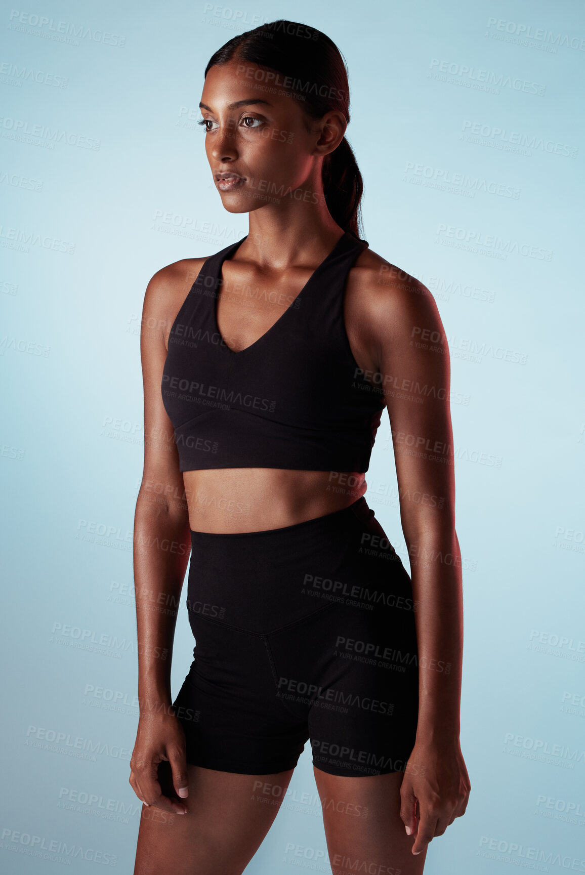 Buy stock photo Fitness, training and a woman serious about health on blue studio background. Thinking, focus and concentration on exercise and motivation to workout with sport model with healthy, fit and slim body