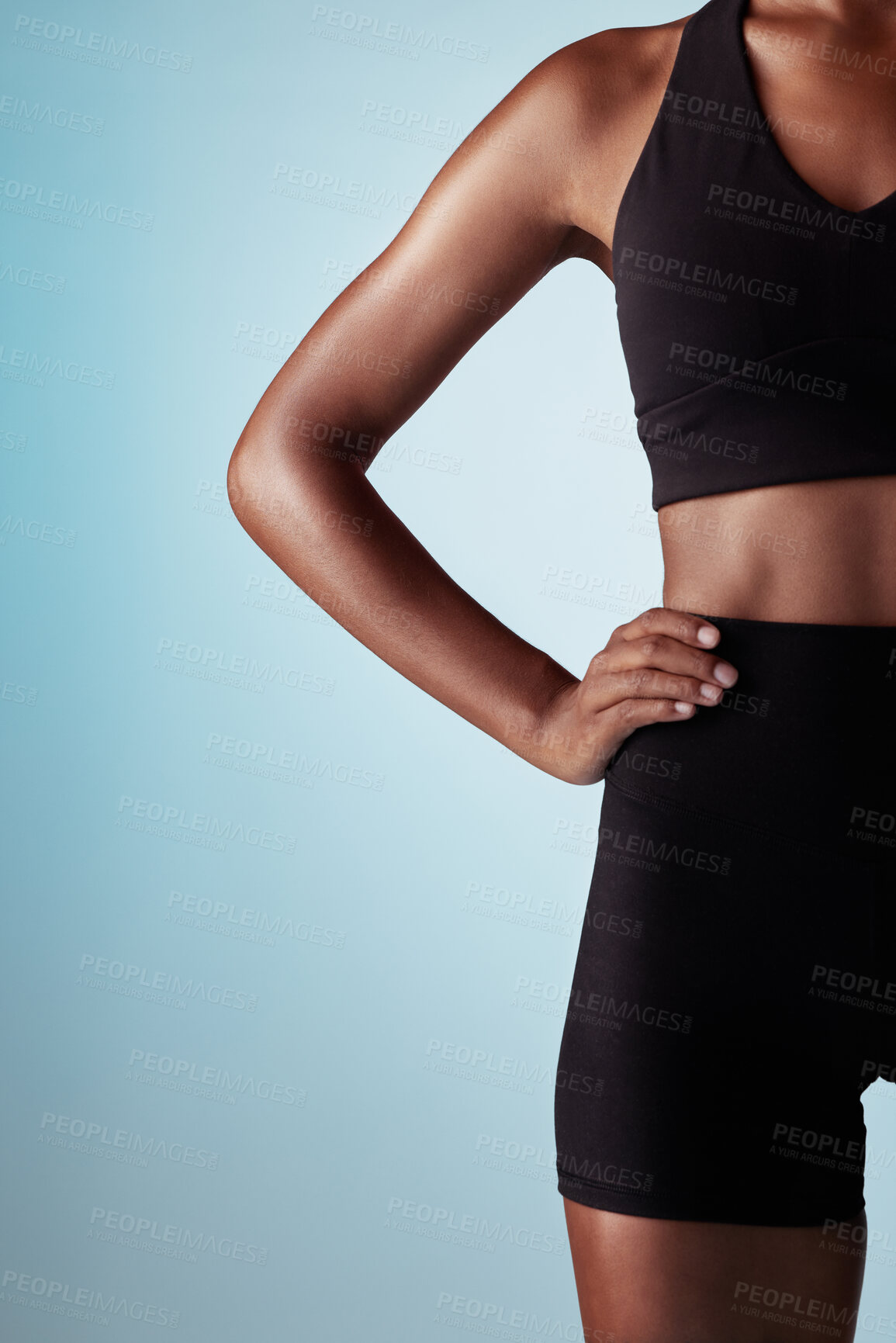 Buy stock photo Fitness, body and black woman in studio with workout fashion, skincare and wellness on blue mock up for advertising or marketing space. Sports, runner or athlete zoom in training clothes and mockup