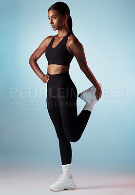Buy stock photo Workout, body and stretching legs of woman in studio mock up for fitness fashion, wellness lifestyle or exercise clothes advertising. Trendy black woman or model training on blue mockup for marketing