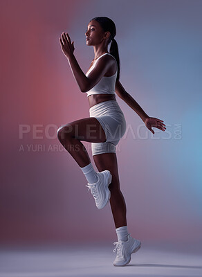 Buy stock photo Runner, fitness and girl in studio running, cardio training or doing full body aerobic workout exercises. Healthy woman, sports and fitness model athlete with energy ready to start sprinting action