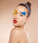 Beauty, makeup and clown by woman in studio for fun, art and creative expression against a brown background with mockup. Face, portrait and pigment cosmetic product with girl model circus aesthetic  