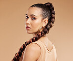 Beauty, fashion and makeup, woman with braid, serious face and luxury cosmetics and hair care. Health, wellness and skincare, portrait of cool beautiful girl from Mexico with long braided hairstyle.