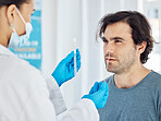 Covid test, patient and nose swab of a doctor test a man for corona in a hospital or clinic. Healthcare, medical and health consultant working ion nurse help to assist in a medicine consulting