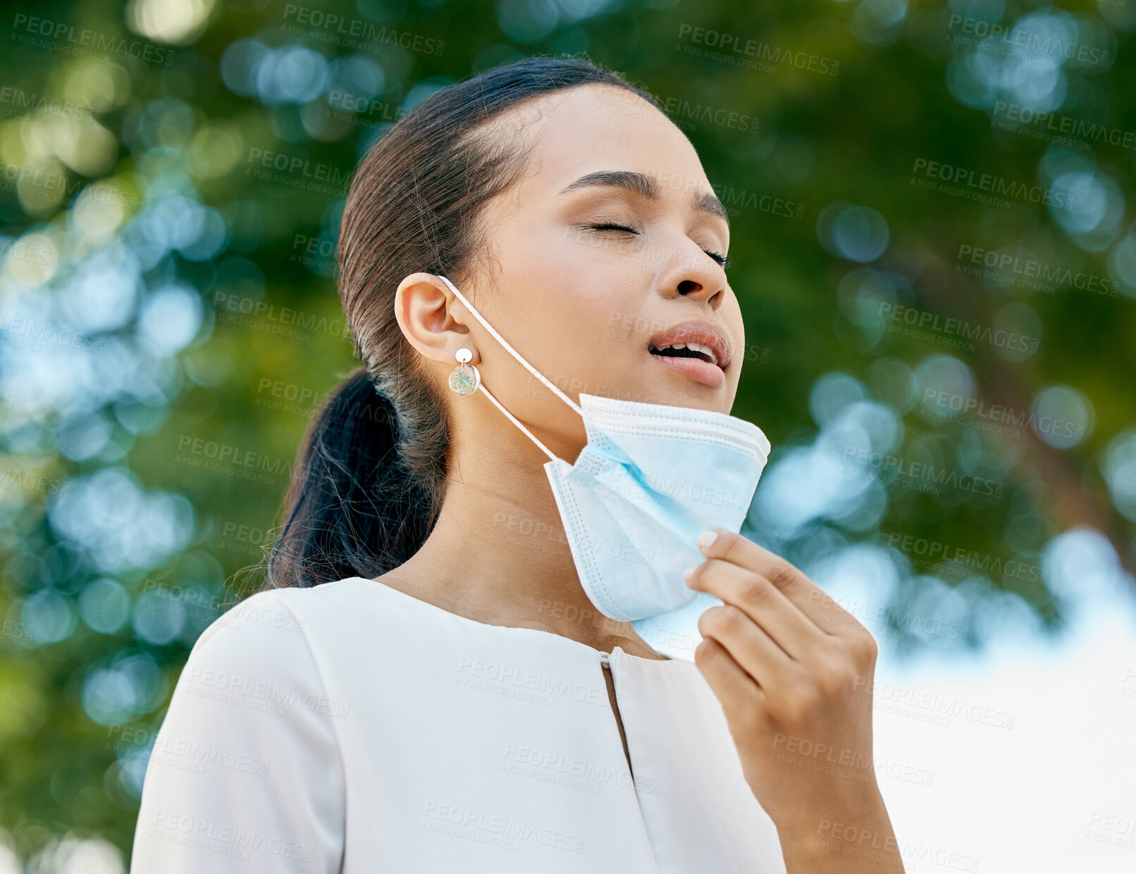 Buy stock photo Covid, removing face mask and breathing air in park for healthcare, lung wellness and outdoor clean environment for compliance, safety and trust. End of covid 19 with girl in mask breathe in nature