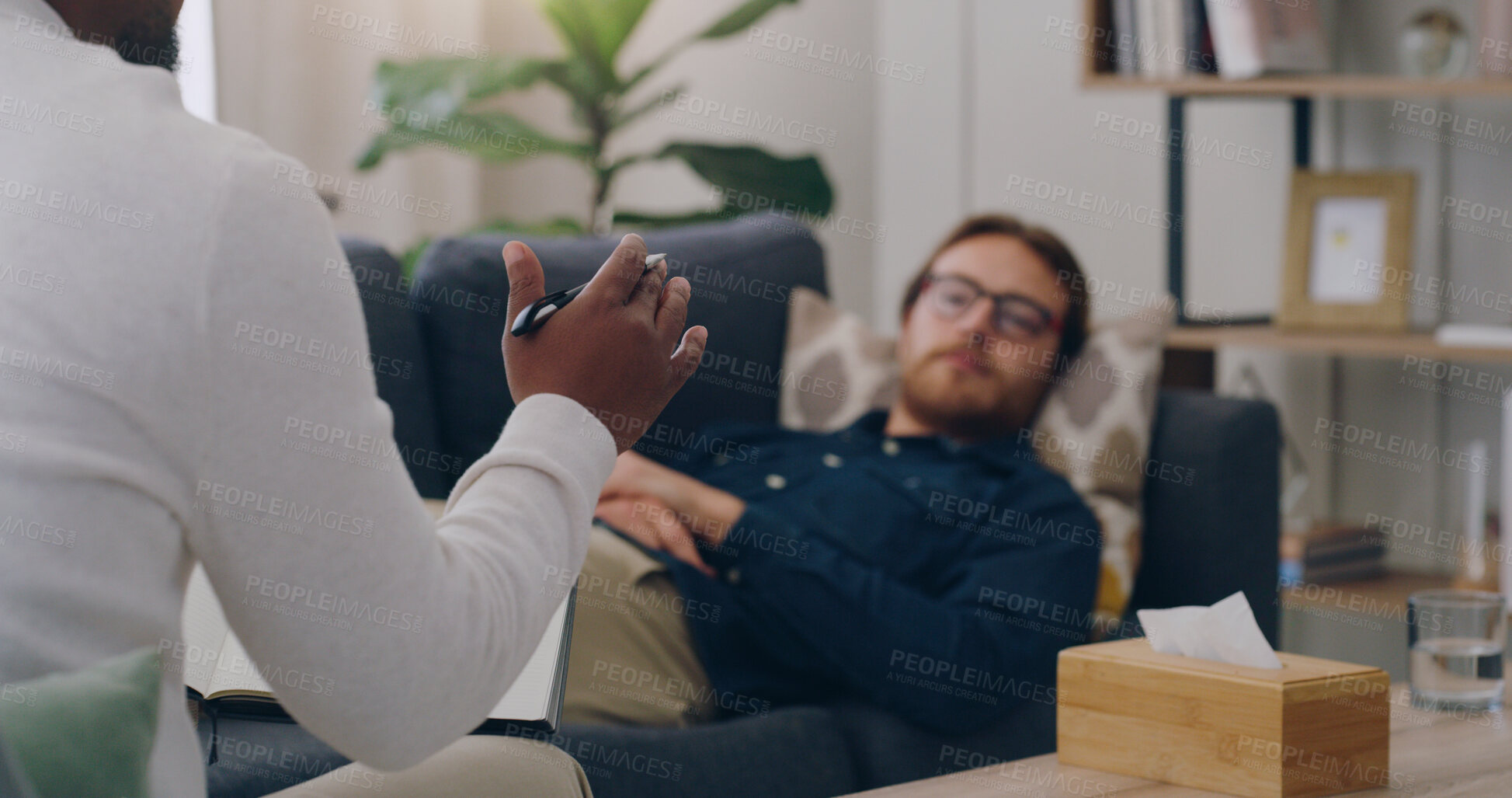 Buy stock photo Psychology, mental health and man in a meeting with a psychologist talking, communication and sharing problems. Counseling, support and therapist listening and helping with healing advice in therapy