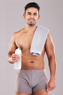 Buy stock photo Man, body and water bottle for fitness on studio background in workout, training or exercise for health, wellness or strong muscles. Portrait, smile and happy sports athlete with drink or sauna towel