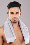 Grooming, clean with towel and hygiene, man in beauty portrait, skin and face care with studio background. Shaving, skincare and wellness, cleaning and healthy glow for body and cosmetics.