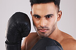 Fitness boxing, man training workout and action portrait of exercise gear on fists ready to fight. Young muay thai athlete, strong muscle power motivation and mma sports boxer face in gym with gloves