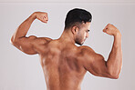 Muscle, bodybuilder and man flex, with natural body and confident with purple studio background. Muscular, young male and show arms with pride, flexing and fitness for wellness, health and motivation