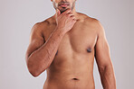 Fitness, health and man body in a studio shirtless after a workout, exercise or sports training. Healthy, motivation and guy or athlete with strong torso, chest or abdomen standing by gray background