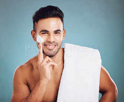 Buy stock photo Beauty, shaving and cream portrait of man happy with preparation for grooming, cleaning and facial hair removal. Hygiene cosmetic model with shave foam on face and smile in teal studio with mockup.

