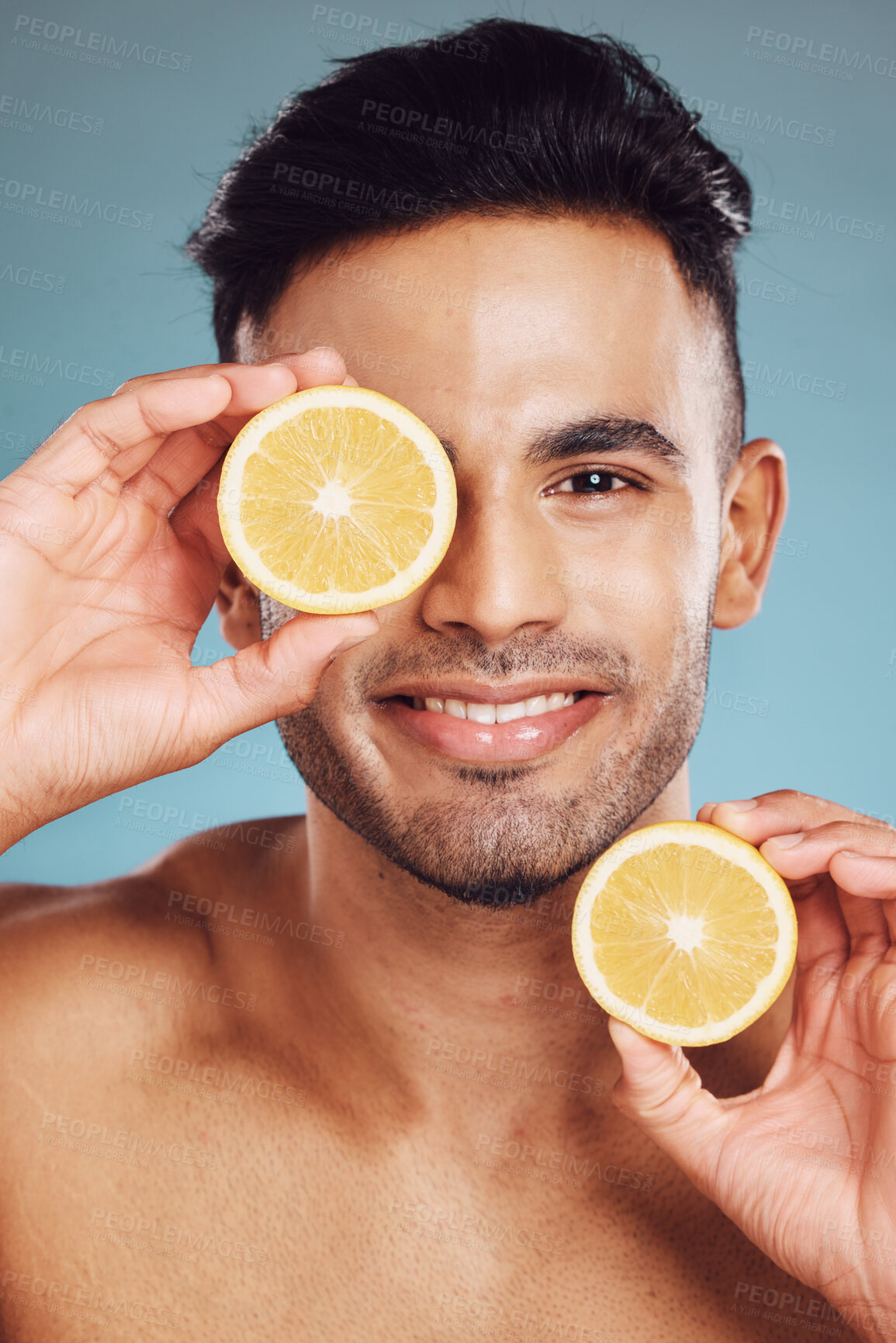 Buy stock photo Lemon, vitamin c and natural beauty skincare cosmetics for facial, body care and man happy with results on studio background. Smile model portrait, organic fruit dermatology, healthy and clean face