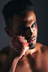 Violence, man and portrait with blood fist of angry fighter with bruise, injury and wound plaster. Boxer, fitness and anger aggression of mma person with intense dark studio shadow background.