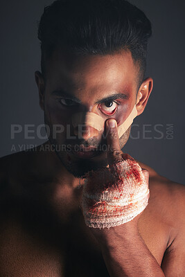 Buy stock photo Blood, boxing injury and man with bruise from fight conflict, criminal violence or dark crime with middle finger emoji sign. Shadow, rebel lifestyle and portrait of mma boxer with first aid bandage