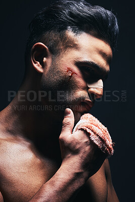 Buy stock photo Injury, blood and man with a bandage from fighting or training for MMA or kickboxing in a dark studio. Violence, hurt and  guy boxer from Mexico after sports competition isolated by black background.