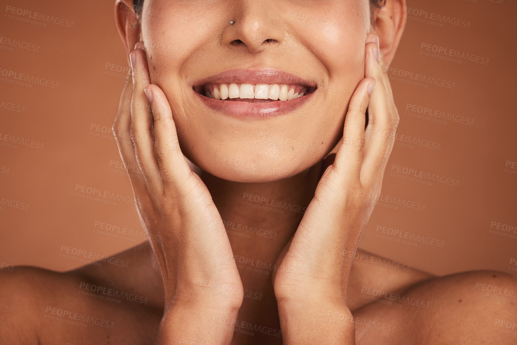 Buy stock photo Woman, hands and smile with teeth in skincare beauty or facial treatment against a studio background. Hand of female model touching face and smiling in luxury satisfaction for perfect skin cosmetics