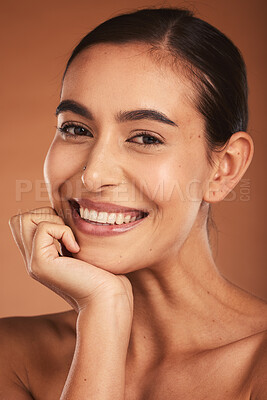 Buy stock photo Portrait, beauty and skincare with a model woman posing in studio on a beige background to promote healthy skin. Face, wellness and luxury with an attractive young female indoors to promote cosmetics