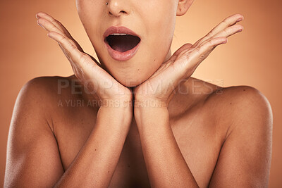 Buy stock photo Surprise, woman and hands for skincare, natural beauty, and excited on brown studio background for cosmetics or bare. Wow, makeup or young female with shocked expression, organic facial or mouth open
