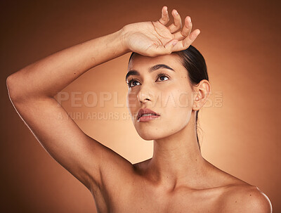 Buy stock photo Beauty, skincare, and health of a woman with hand on head for wellness, self care and and self love of body and mind. Girl model with glow in studio from makeup, cosmetics and dermatology mockup