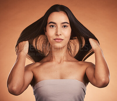 Buy stock photo Beauty, hair and skin with woman in makeup portrait, natural cosmetic and hair care against orange studio background. Skincare, cosmetics treatment and hairstyle with wellness and keratin glow.