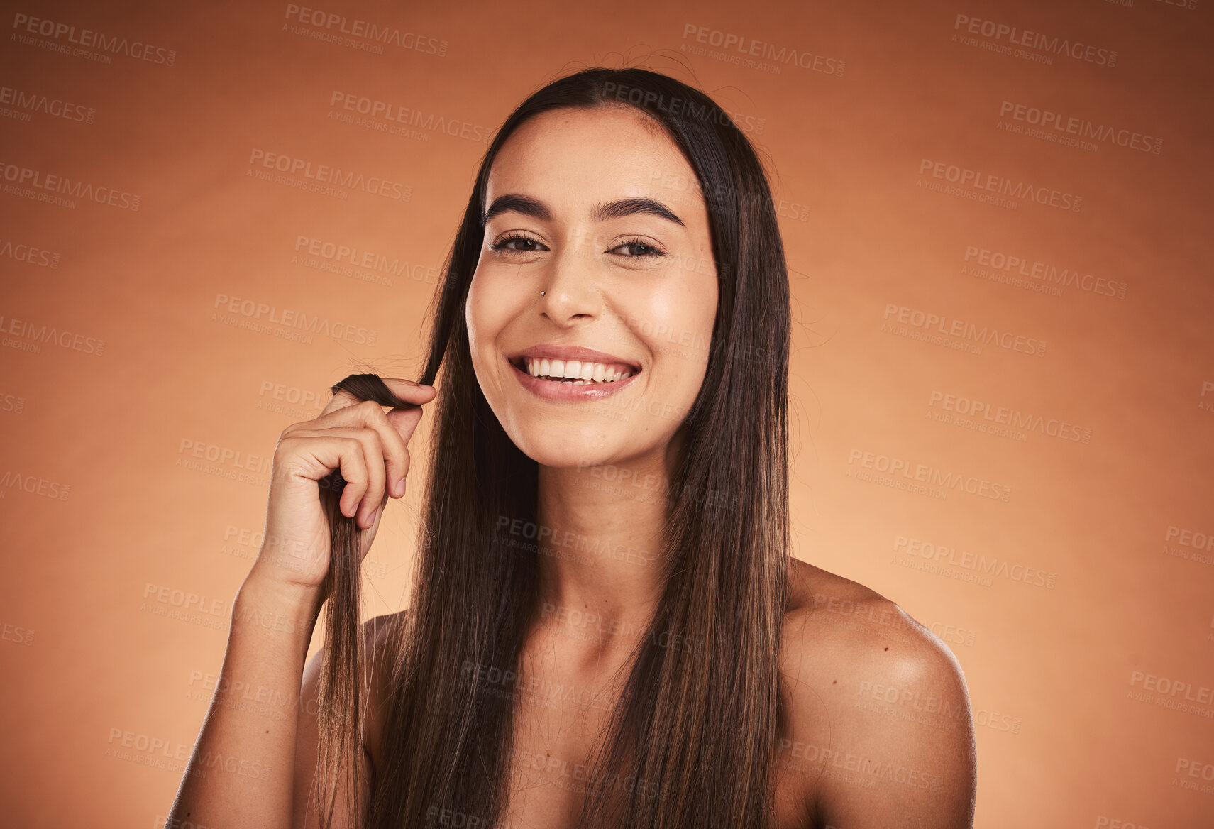 Buy stock photo Cosmetics, hair care and young woman pride with natural beauty, healthy and confident with brown studio background. Portrait, makeup and girl playing with hair, wellness and organic for happiness.